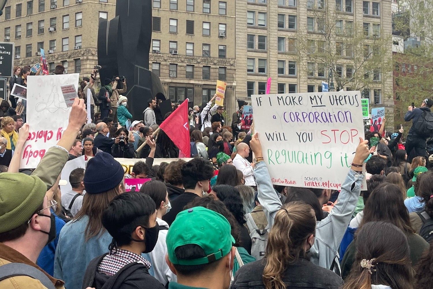 A crowd of people holding signs in support of abortion rights.