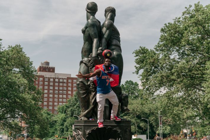 Leh-Boy perches atop a statue at Grand Army Plaza.