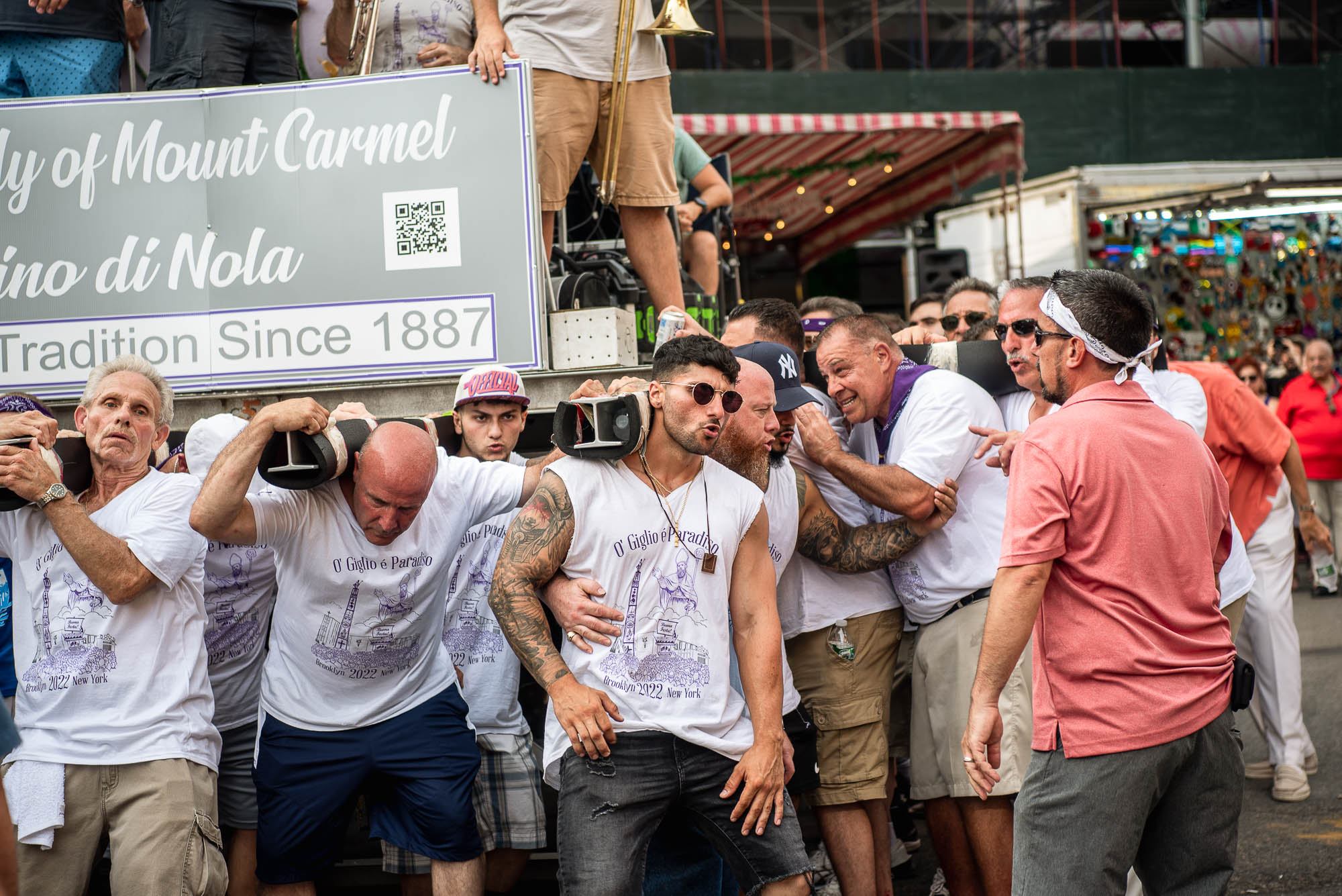 A group of burly men lift the Giglio