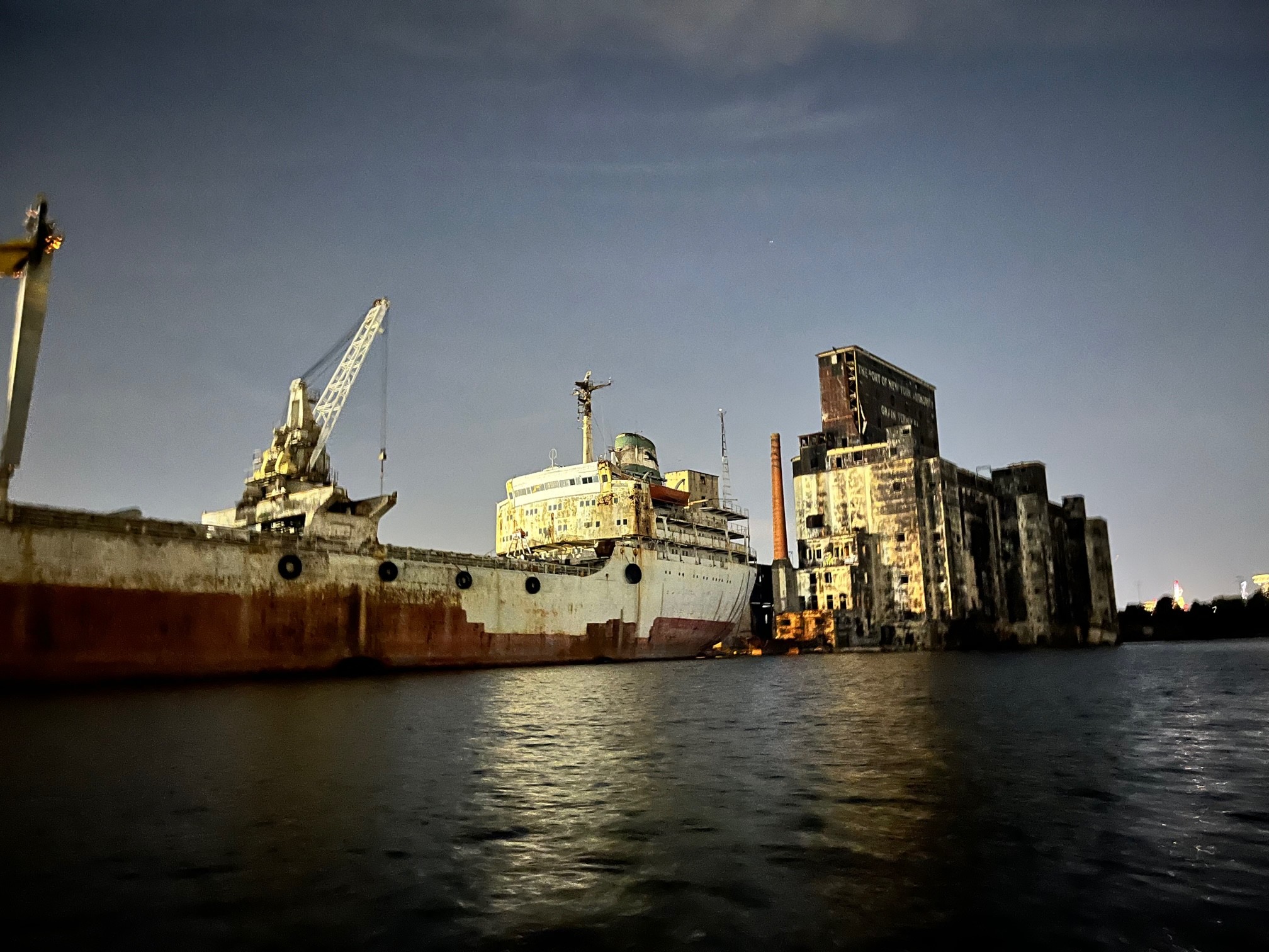 The Loujaine, a ship permanently docked in the Gowanus Bay, at dusk.