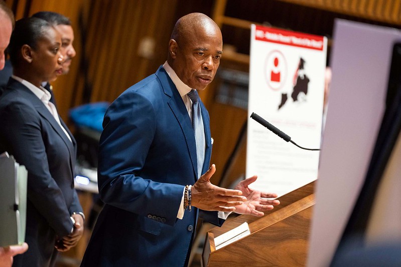 Mayor Eric Adams in a blue suit, during a press conference on August 3, 2022