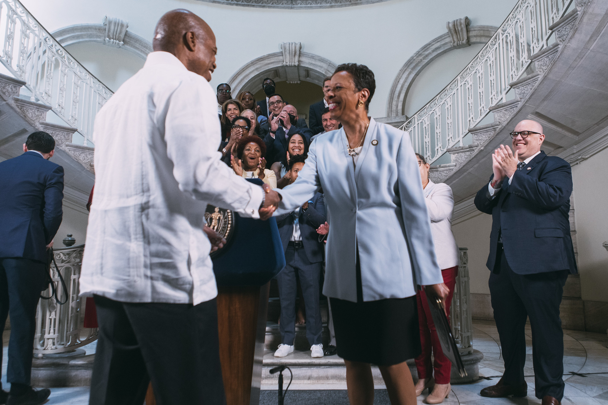 Mayor Eric Adams and City Council Speaker Adrienne Adams shake hands upon the budget agreement on June 10, 2022, in the City Hall rotunda.