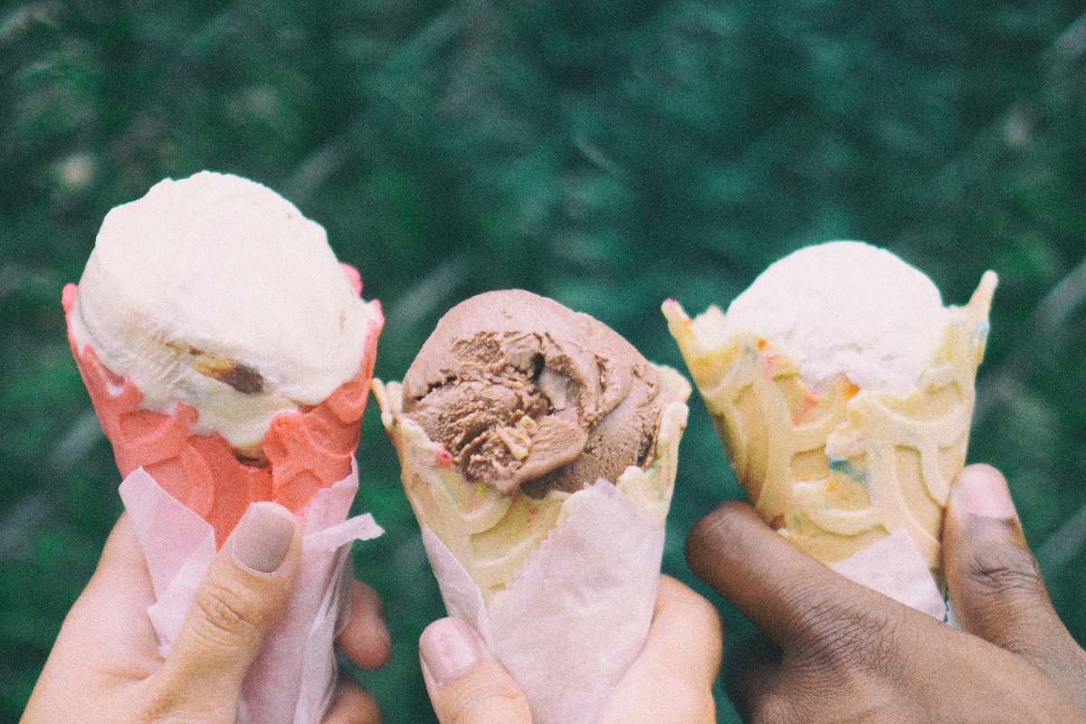 A close-up of three ice cream cones.