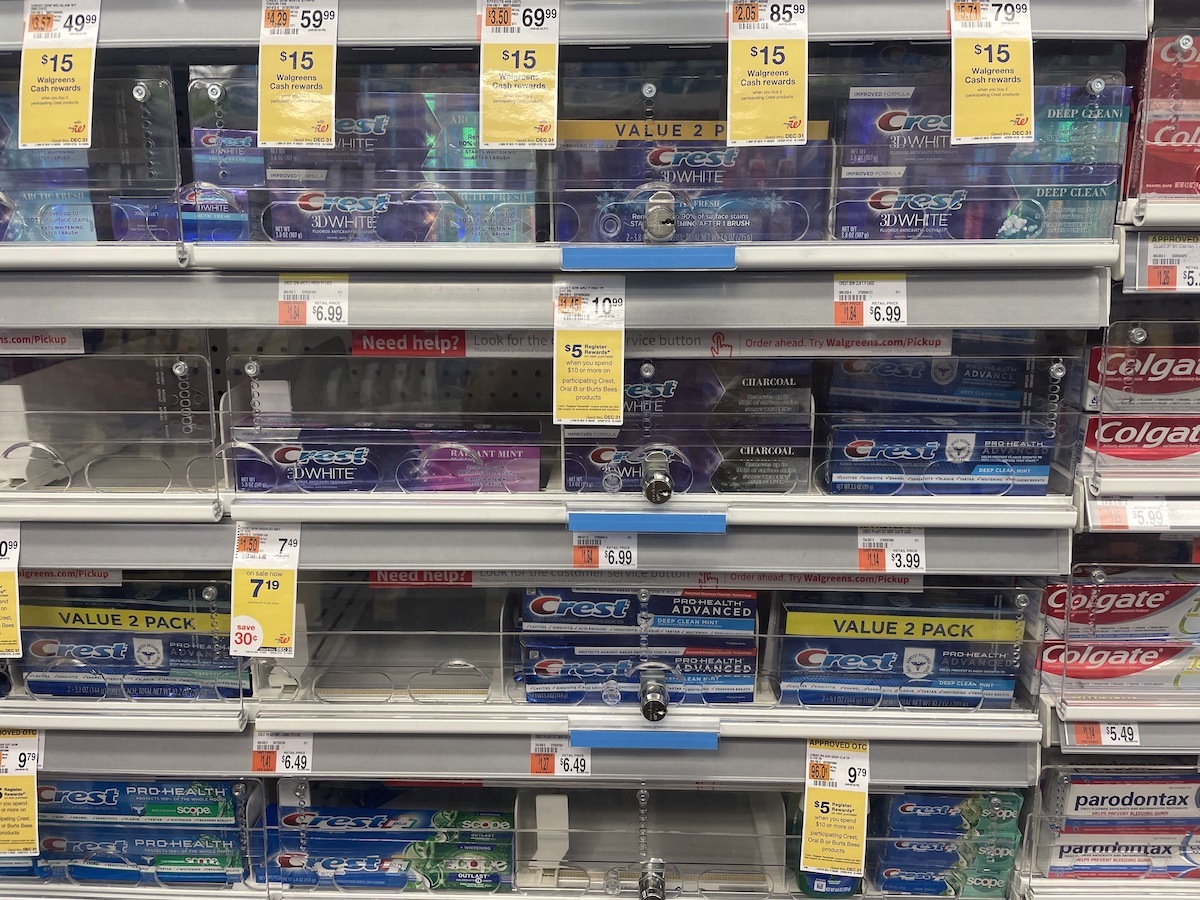 Tubes of toothpaste under lock and key on a shelf in a pharmacy in Manhattan.