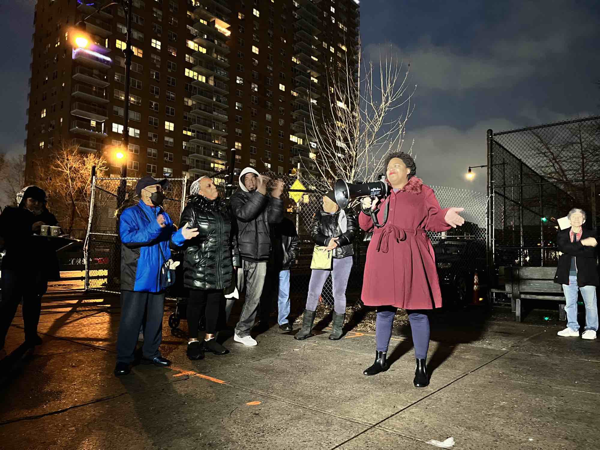 Councilmember Kristin Richardson Jordan holding a bullhorn, speaking at a rainy protest against the truck depot on the site of the One45 project, on Tuesday, January 2, 2023. (Hell Gate)
