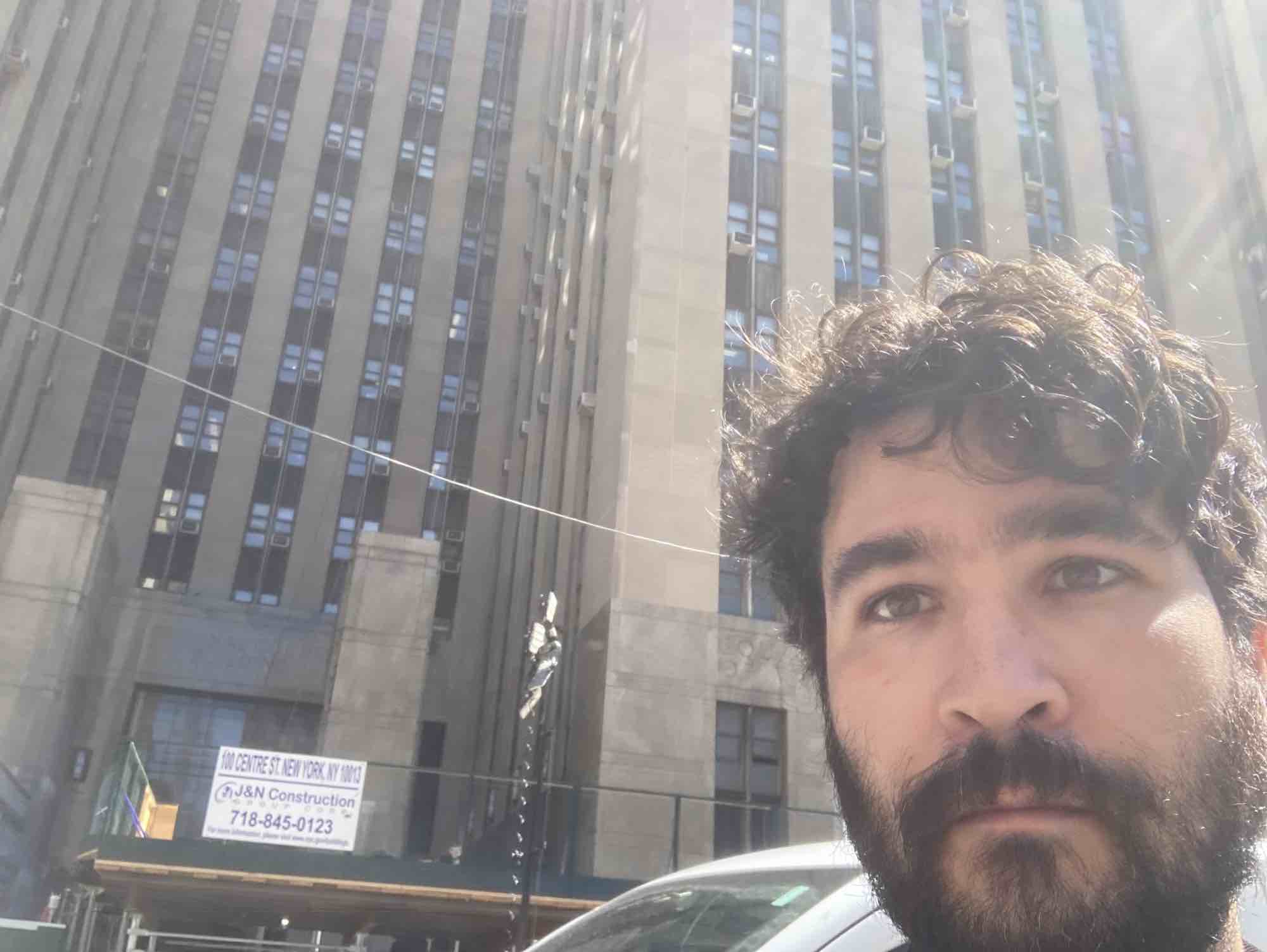 Max Rivlin-Nadler takes a selfie outside 100 Centre Street.