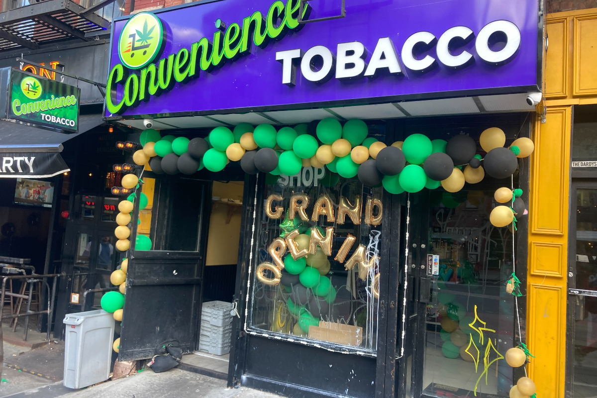 A closed weed bodega storefront in the East Village, decorated for its "grand opening."