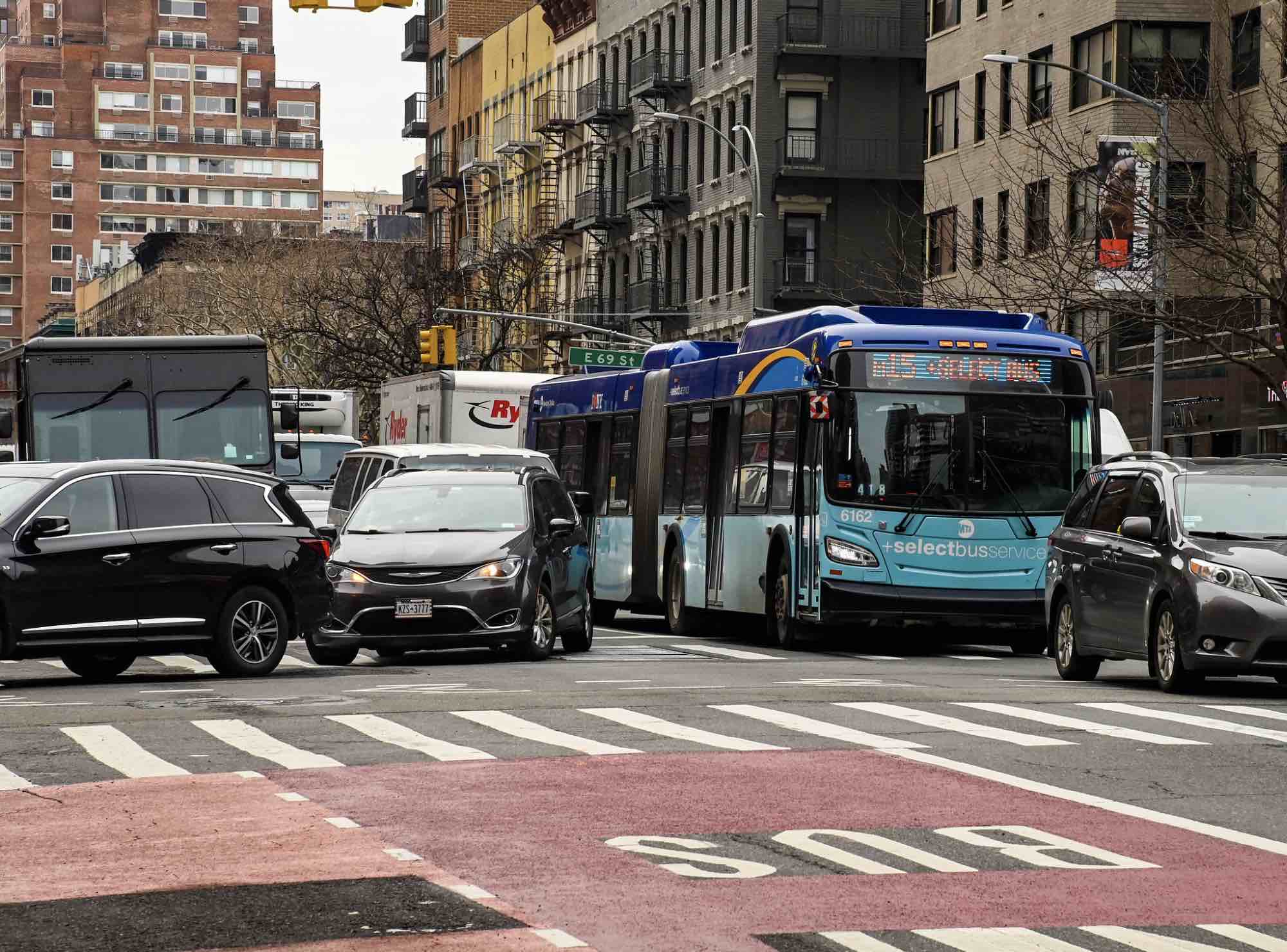 A SBS stuck in traffic in Manhattan.