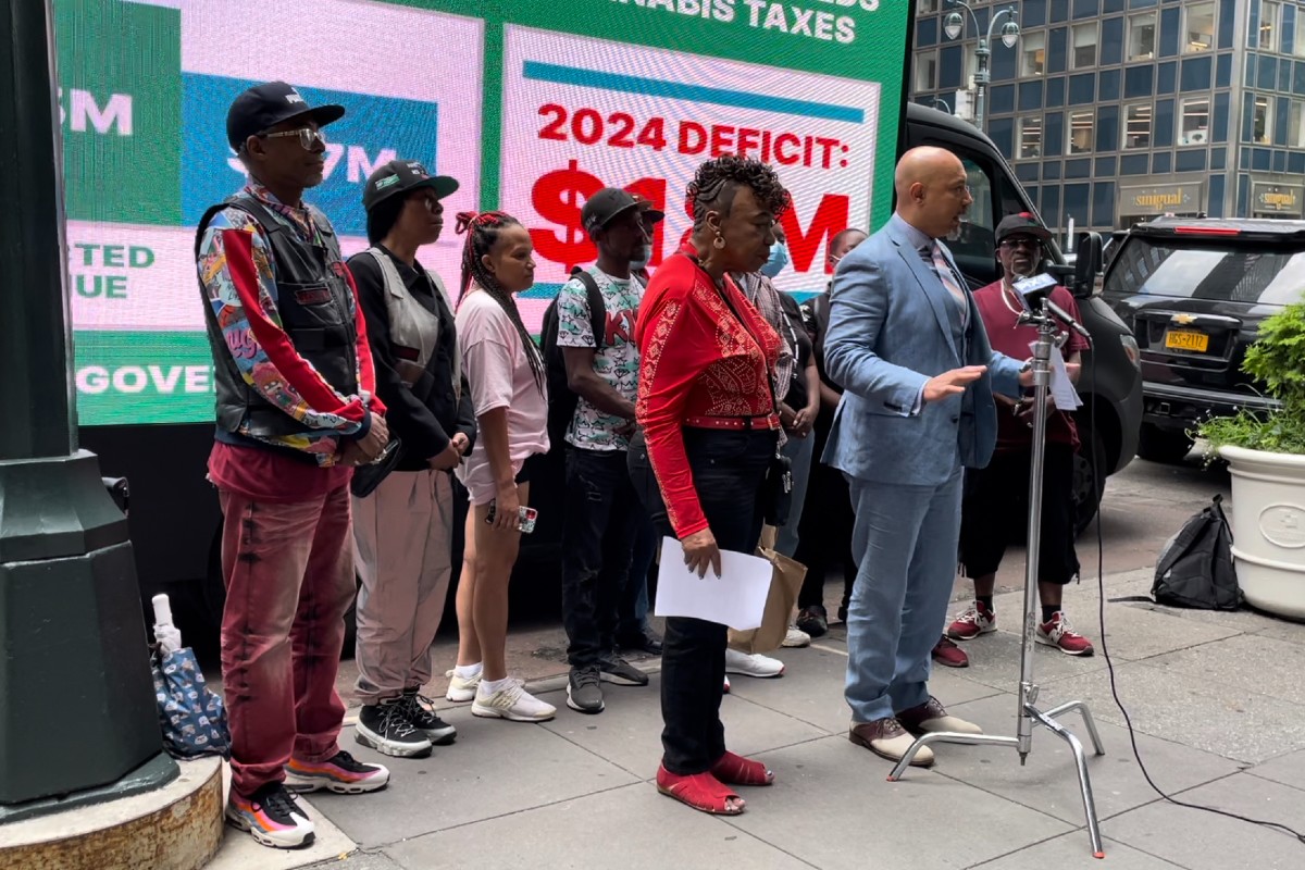 Gwen Carr, Rev. Kirsten John Foy, and other unnamed participants in a rally for the Coalition for Access to Safe & Regulated Cannabis