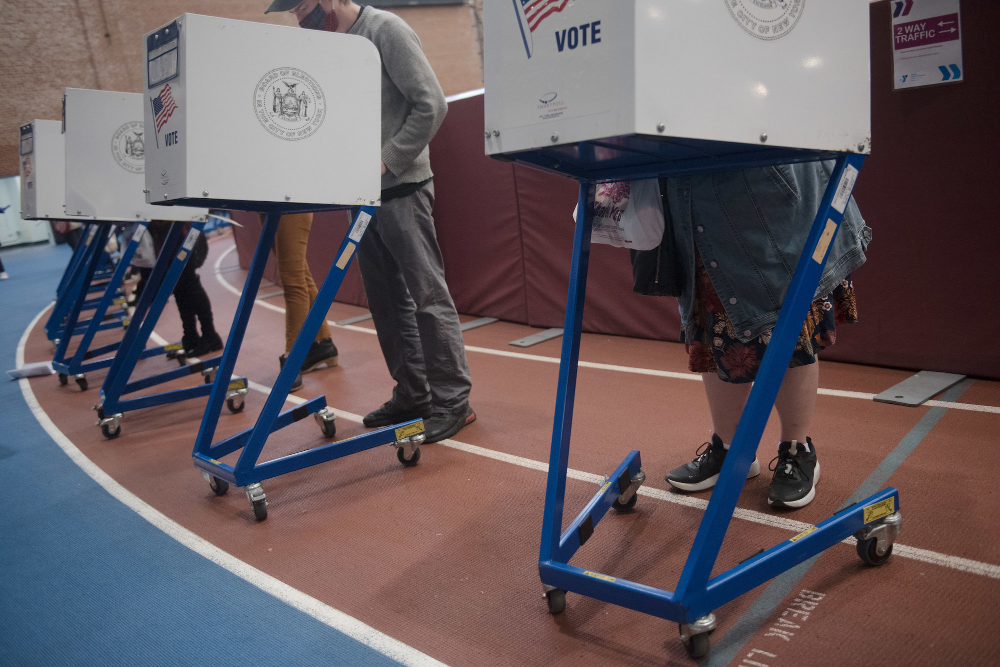 Voters stand and vote during the 2020 election.