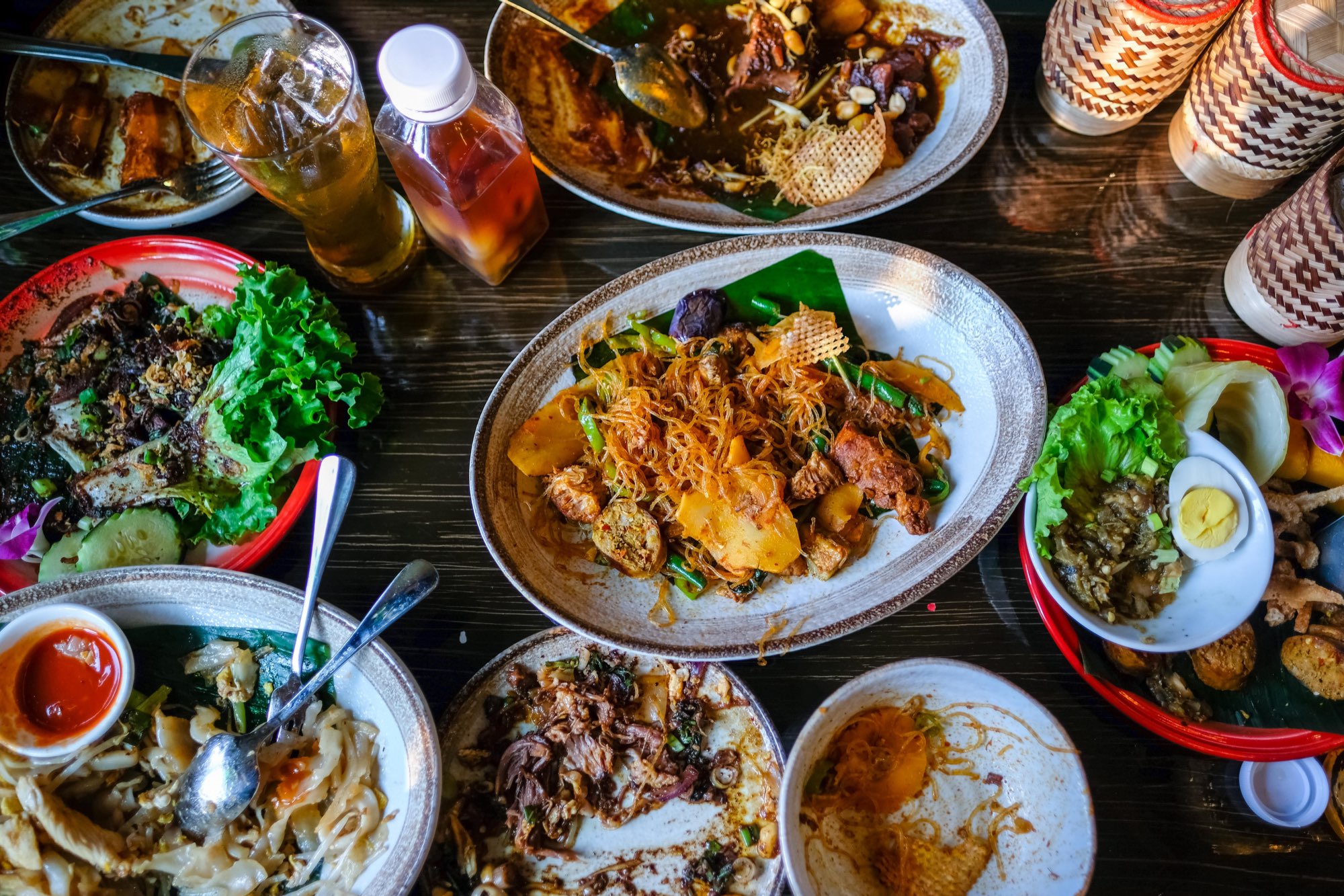 A bunch of Northern Thai dishes laid out on the table.
