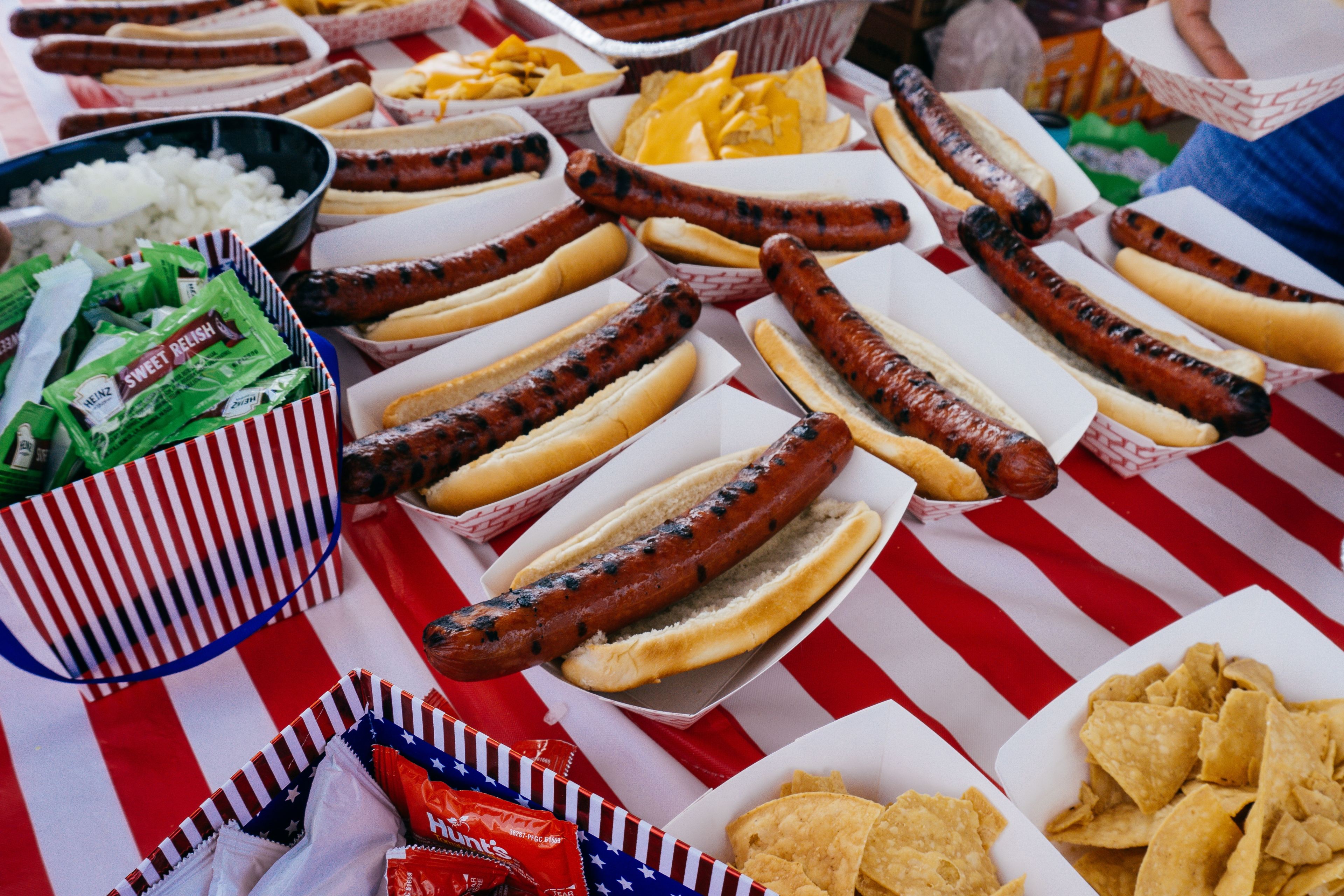 A table full of hot dogs.