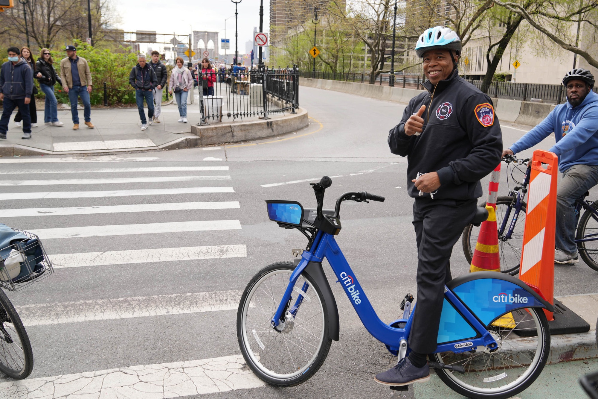 Eric Adams gives a thumbs up on a Citi Bike.