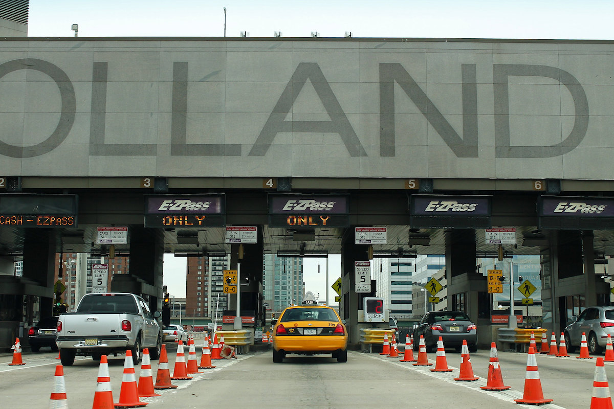 Cars drive into the Holland Tunnel from New Jersey.