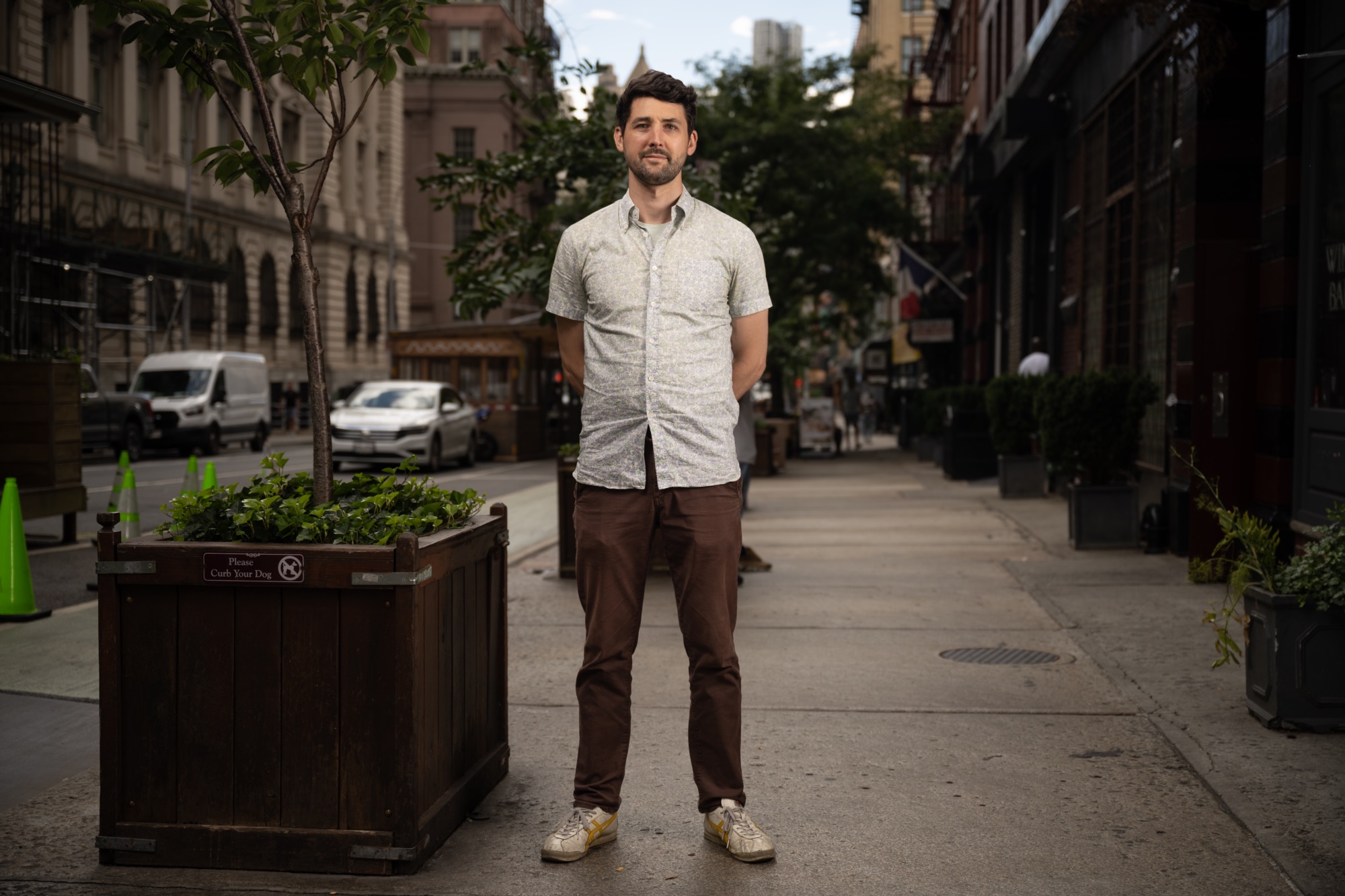 Caleb Ganzer stands for a portrait outside his restaurant on Centre Street.