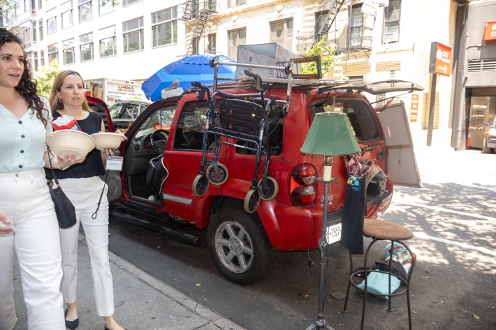 A red SUV is filled with random stuff