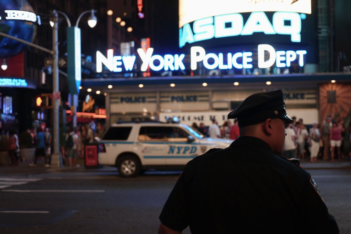 A cop in front of Times Square.