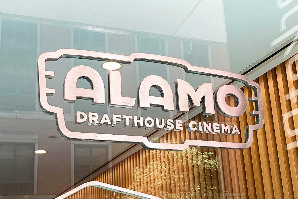 "Alamo Drafthouse Cinema" written on a window.