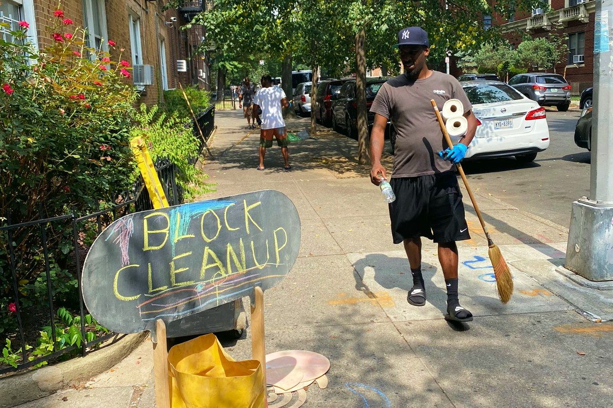 A Flatbush, Brooklyn resident participates in a neighborhood cleanup on his block.