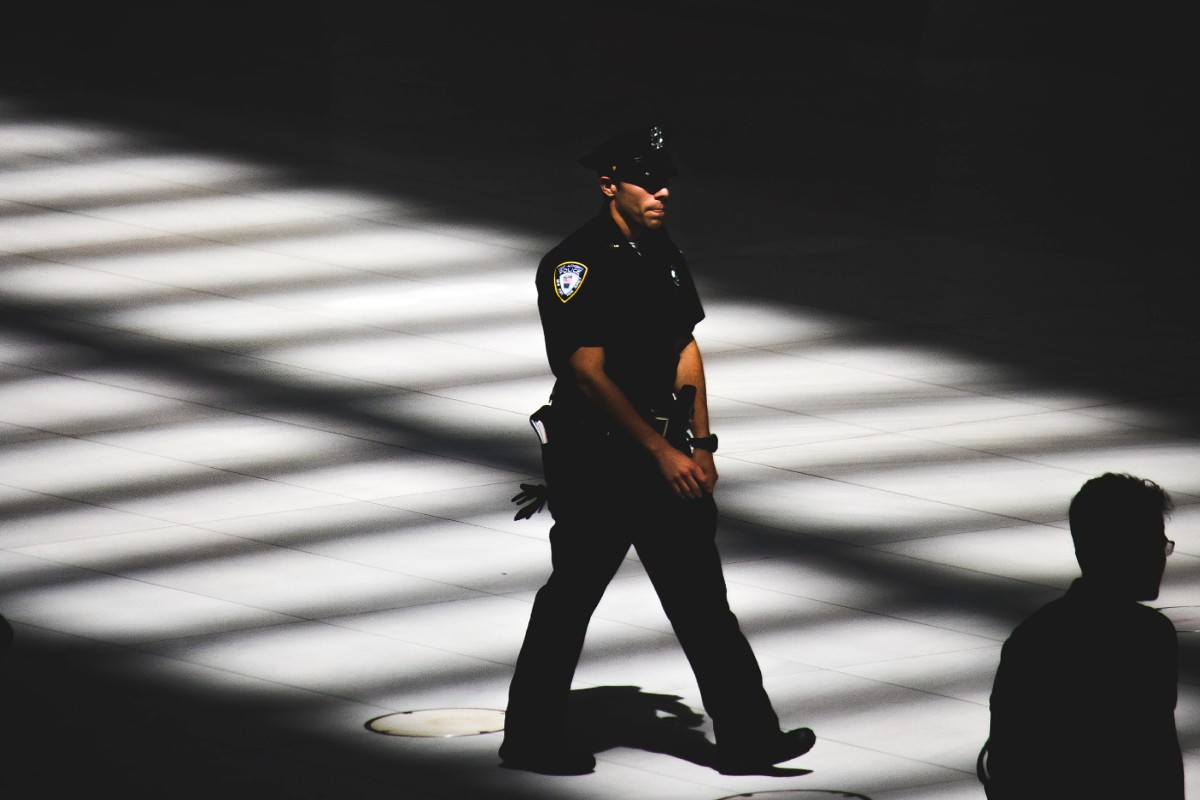 An NYPD officer walking.