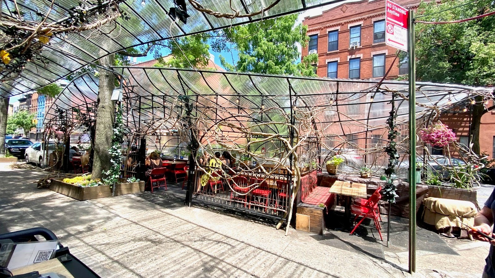 Chez Oscar's outdoor dining setup on a sunny day.