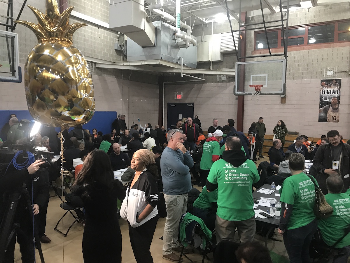 Queens residents pack a gym for the casino town hall meeting.
