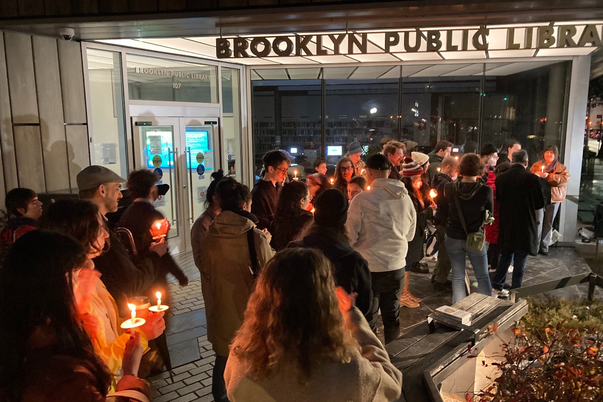 Protesters outside Greenpoint's Brooklyn Public Library branch on its last day of Sunday service. (Hell Gate)