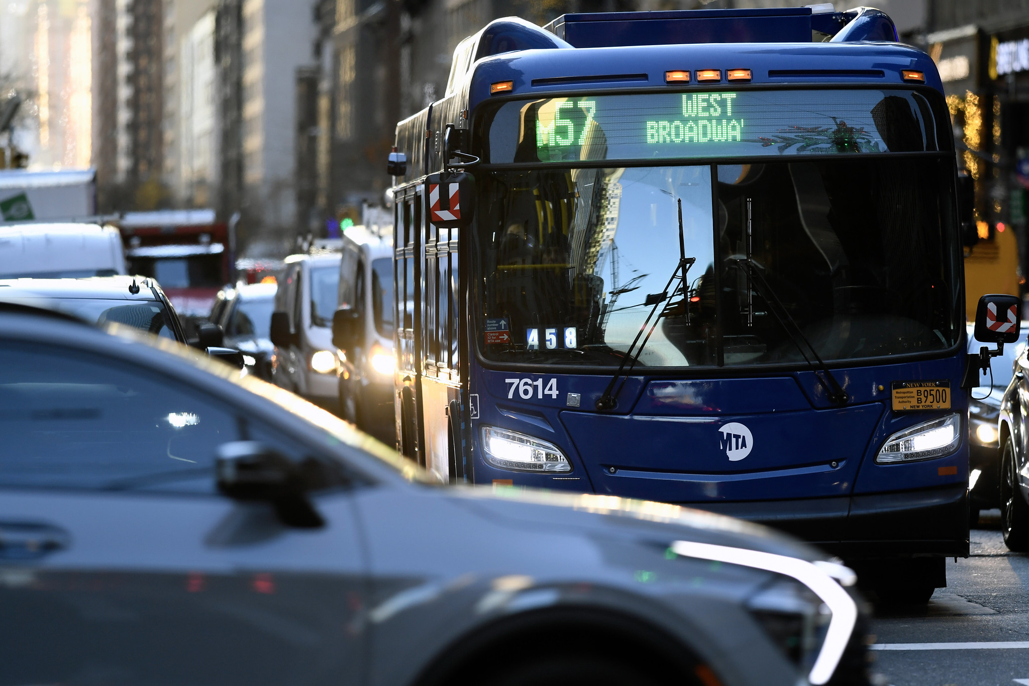 An MTA bus stuck in traffic.