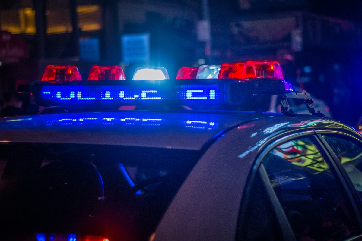 Lights on a NYPD vehicle at night.