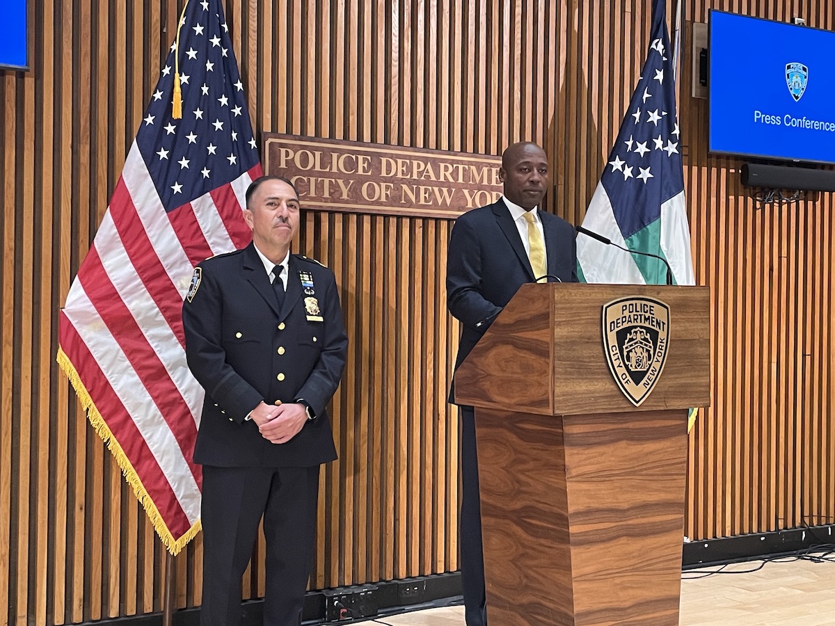 Assistant Chief Carlos Valdez and Deputy Commissioner for Public Information Tarik Sheppard at the podium.